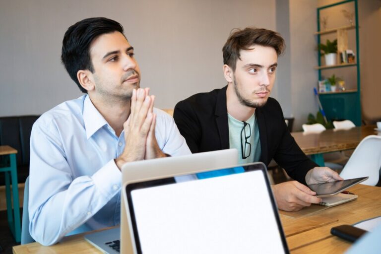 two-professionals-listening-business-conference-speaker_1262-16528